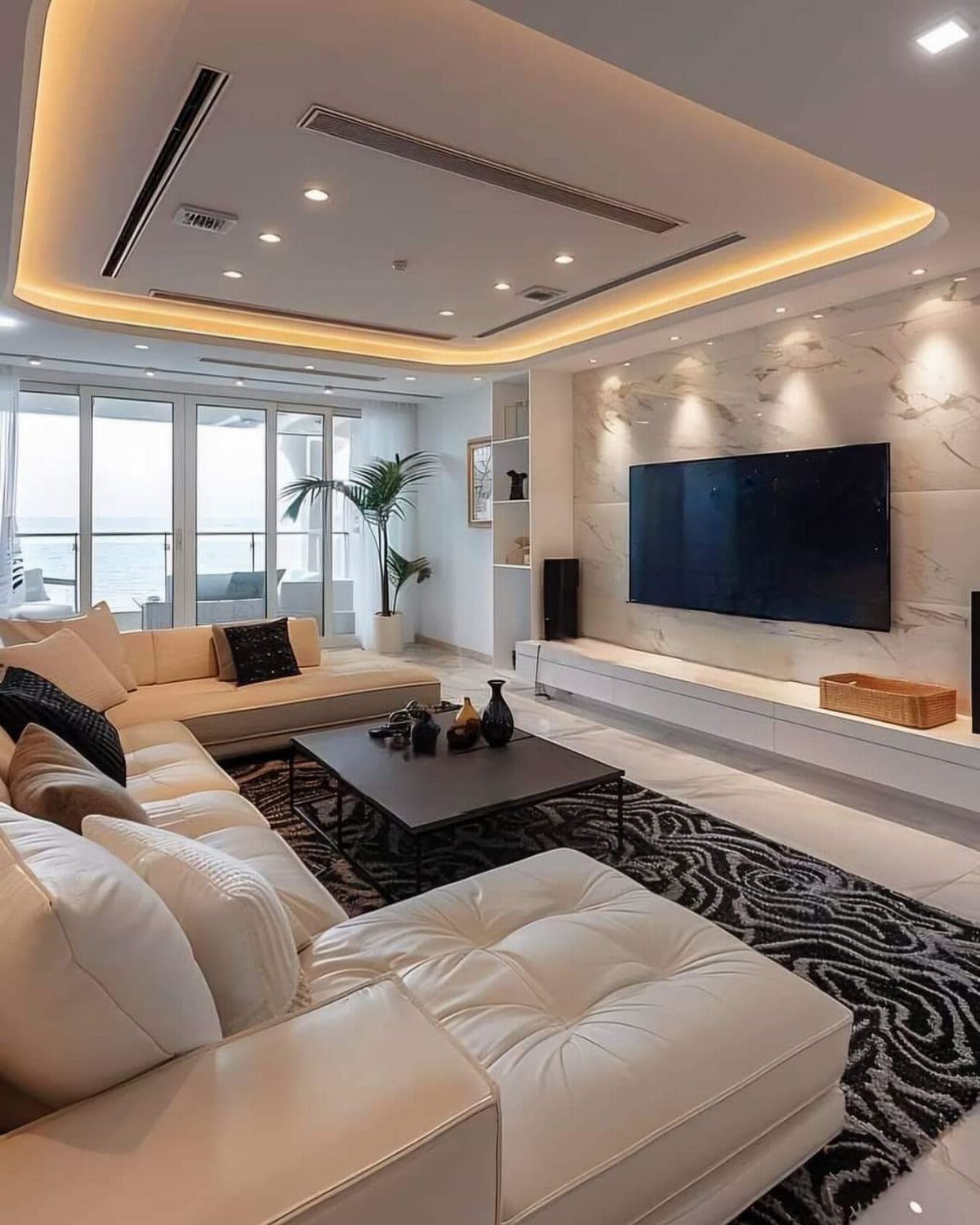 Modern living room with a wall-mounted TV and white floating console unit.